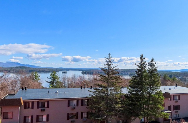 Water view condo with a pool, tennis court, fireplace, balcony & golf nearby