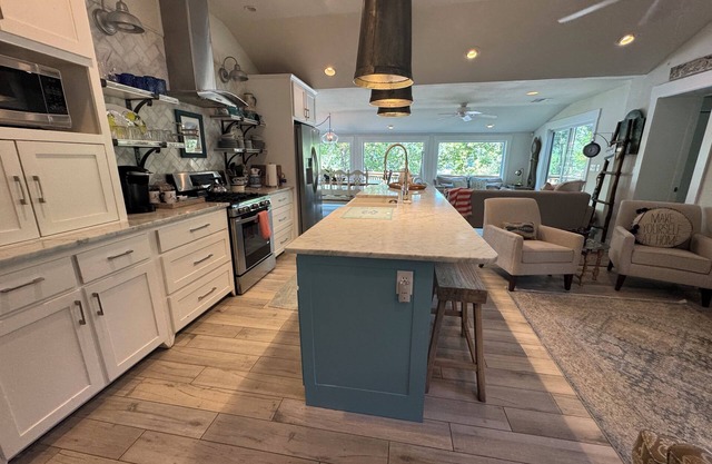 Waterfront beauty with dock and fireplace! Check in Bay! New Hot Tub!