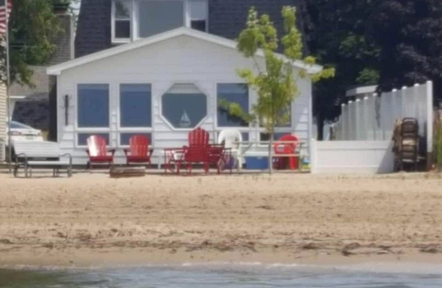 WATERFRONT HOME WITH BEAUTIFUL SANDY BEACH, LOCATED IN TOWN