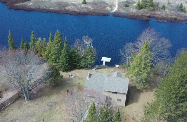 Waterfront house w/large garage located on trail 8 in Grand Marais.