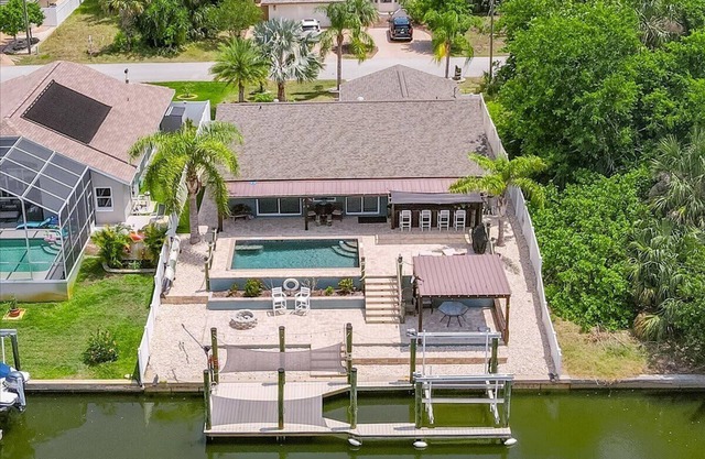 Waterfront Retreat with Pool, Tiki Bar & Boat Dock