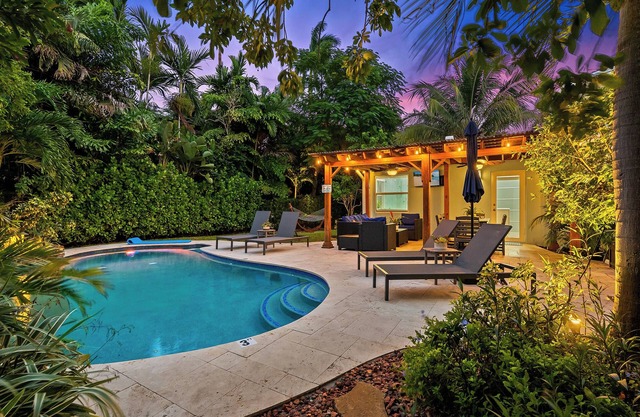 Welcome to Blue Haven, A Charming Tropical Heated Pool Home, Centrally Located!