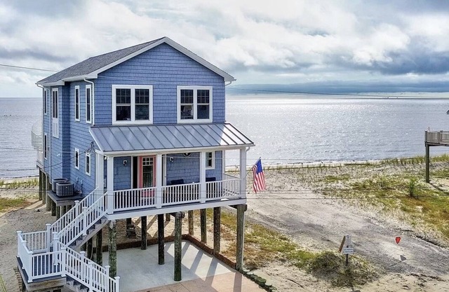 Welcome to the waterfront oasis in the serene community of Kitts Hummock Beach!n