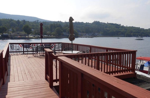 Winnipesaukee lakefront house includes slip, deck, hot tub & sleeps up to 11