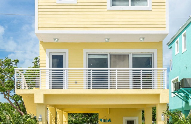 Yellow 3 Story Home