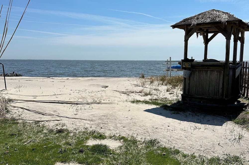 Patchogue Cottage | A charming yellow cottage , where you can place your feet in the sand and relax!