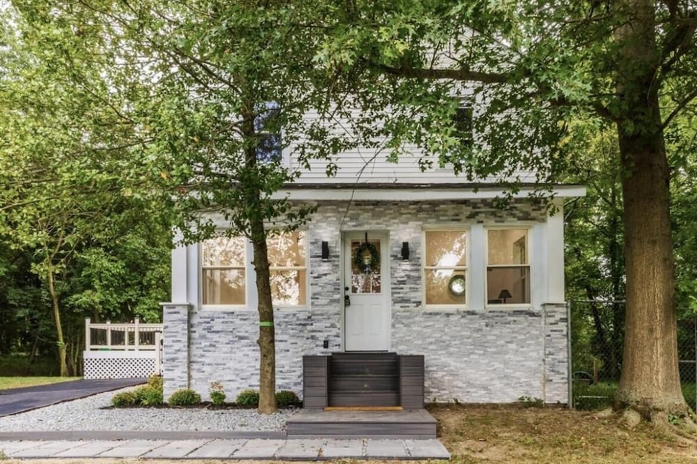 Mickleton House | Embrace the charm of our creekside haven featuring 4BR 3BA yoga and BBQ deck.