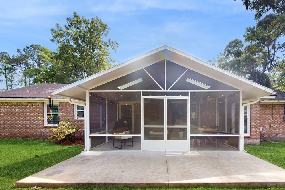 Isle of Hope Historic District House | Updated dog-friendly home with screened porch, children's items, & pellet grill