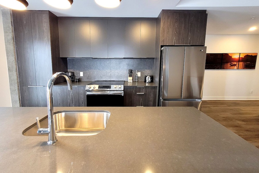 Fabreville Apartment | Corporate Stays - Elegant 3BR with Rooftop, Gym & Lounge