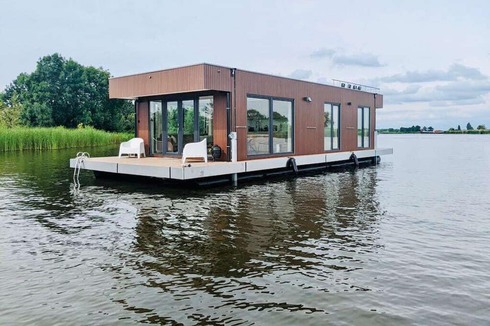 Oud Ade Boat Rental | Houseboat: "De Walvis" at Kagerplassen with tender. 4+ 2 kids