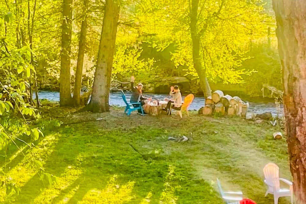 Joseph Cottage | Camp-themed dog-friendly cabin with mountain views, firepit, & river access