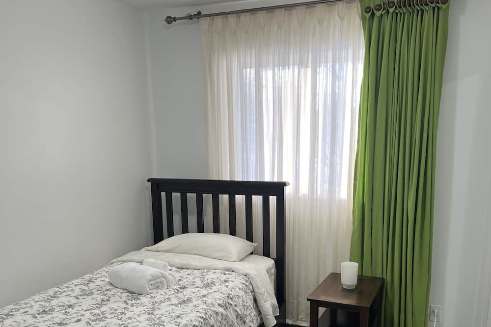 Brandon Apartment | Comfortable Stickney bedroom.