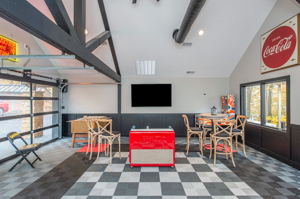 Sparta Township House | Aspen-style lakefront retreat house with hot tub, game room