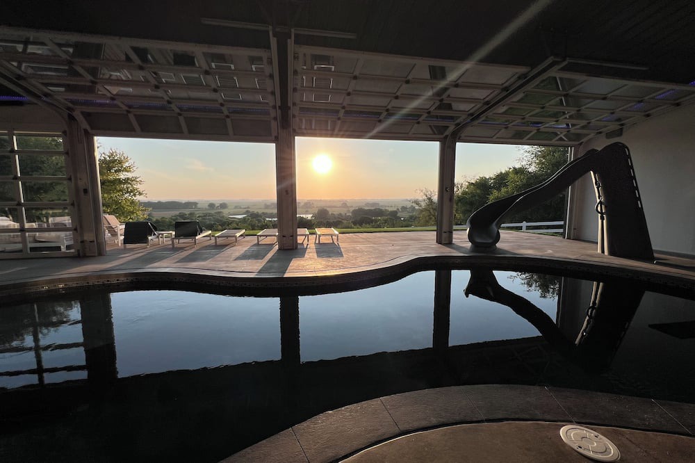Pershing House | Family-Friendly Nebraska Estate with Scenic Pool, Gym, Theater & Fire Pit Fun