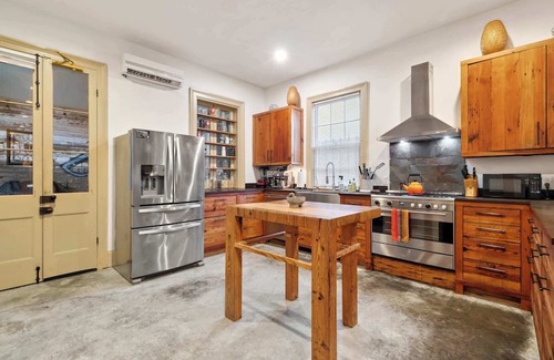 Seventh Ward House | Rustic Industrial Home w heated Pool/Hot Tub, Steps to FQ