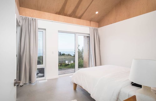 Inverness House | Modern 4 Bedroom, 4.5 bath home near Cabot Links with ocean views and sunsets.