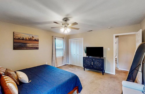 Isle of Hope Historic District House | Updated dog-friendly home with screened porch, children's items, & pellet grill