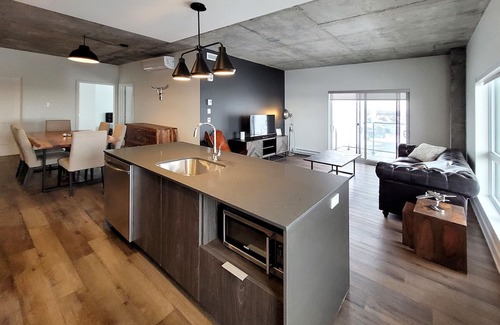 Fabreville Apartment | Corporate Stays - Elegant 3BR with Rooftop, Gym & Lounge
