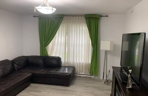 Brandon Apartment | Comfortable Stickney bedroom.