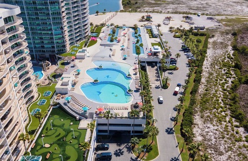 Orange Beach East Condo | Luxurious Bayside Four Bedroom Condo with Panoramic Views. Complimentary Boat Slip!