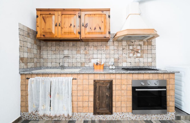 Apartment 'Casa Vacanza Nel Centro Di Irgoli' with Private Terrace, Wi-Fi and Air Conditioning