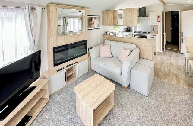 12ft-wide luxury caravan with one double with en suite shower and one twin.