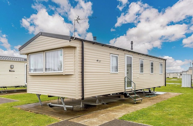 Comfortable modern 12ft-wide caravan with one double and two twin.